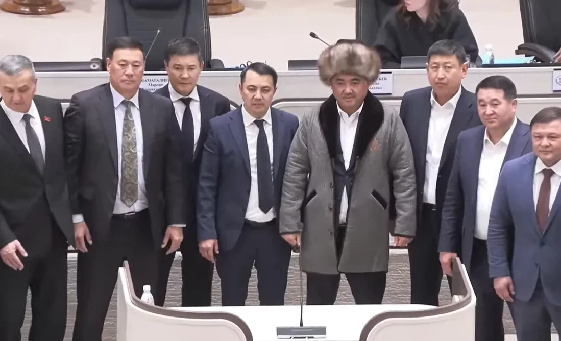 Deputies bid farewell to the ex-speaker by dressing him in a chapan and a tebetey.