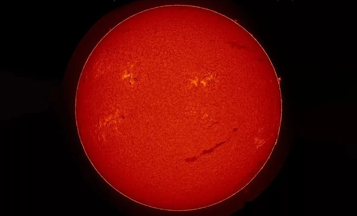 A Huge Anomaly in the Shape of a "Smile" Detected on the Sun